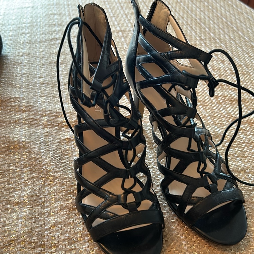 Cage stilletto high heels in black.